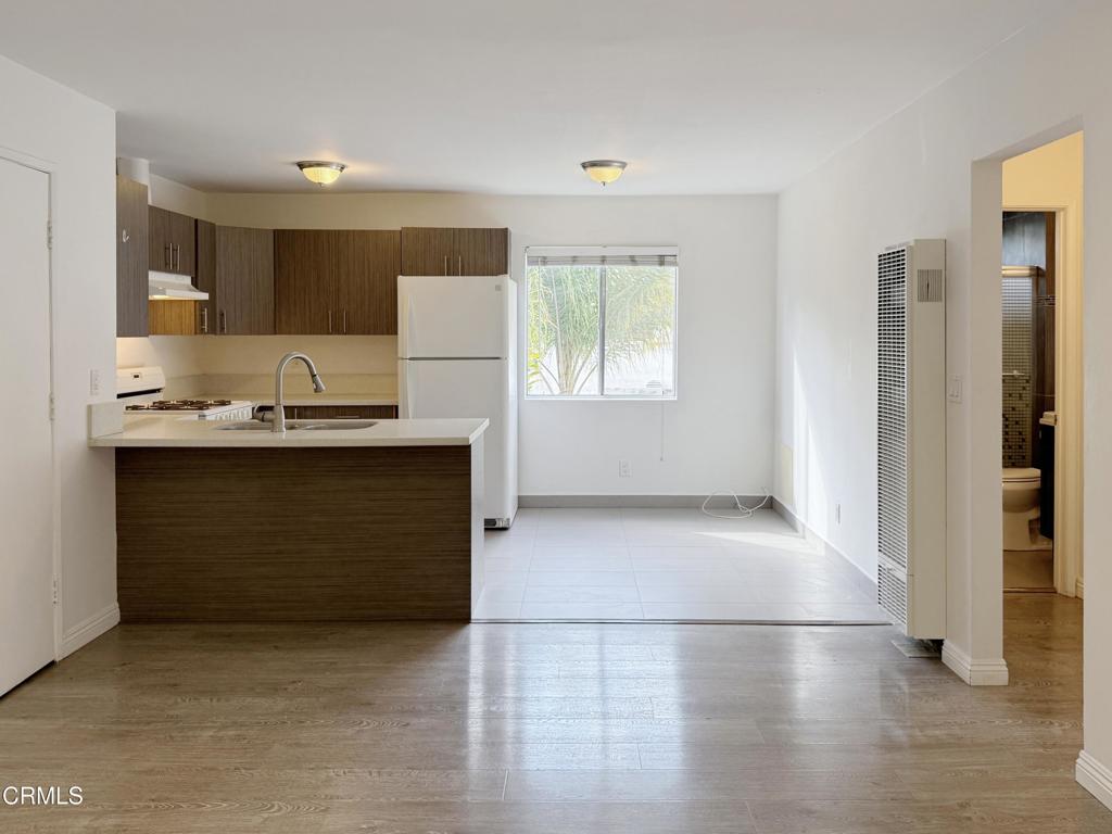 318 Laveta Terrace, Unit 4 Los Angeles, CA 90026 - Photo 1 of 14 a kitchen with stainless steel appliances a sink stove and cabinets
