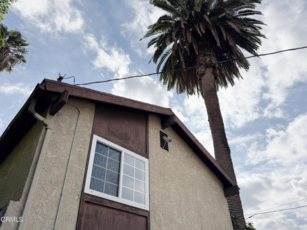 318 Laveta Terrace, Unit 4 Los Angeles, CA 90026 - Photo 2 of 14 a view of a house with a yard