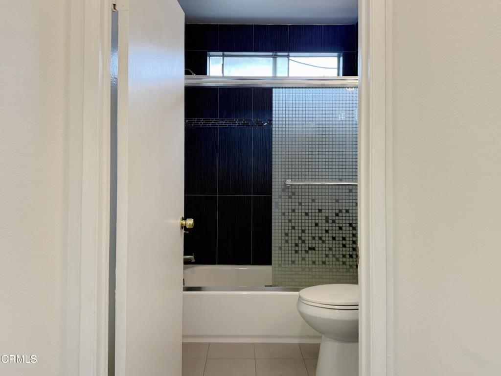 318 Laveta Terrace, Unit 4 Los Angeles, CA 90026 - Photo 7 of 14 a bathroom with a toilet and a shower