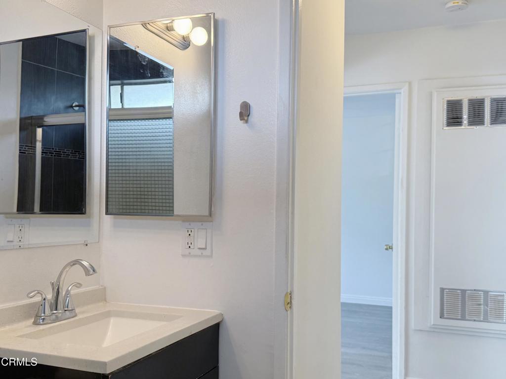 318 Laveta Terrace, Unit 4 Los Angeles, CA 90026 - Photo 8 of 14 a bathroom with a sink and a mirror