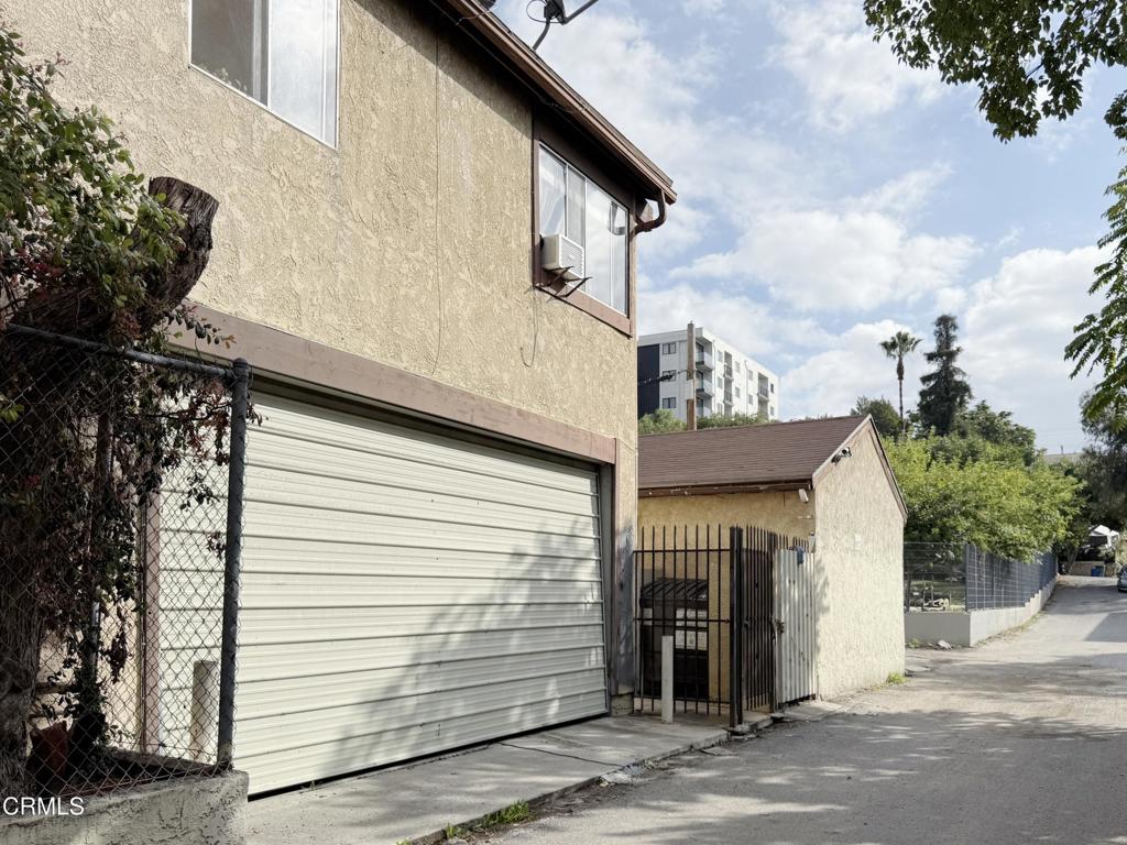 318 Laveta Terrace, Unit 4 Los Angeles, CA 90026 - Photo 9 of 14 a view of a house with a garage