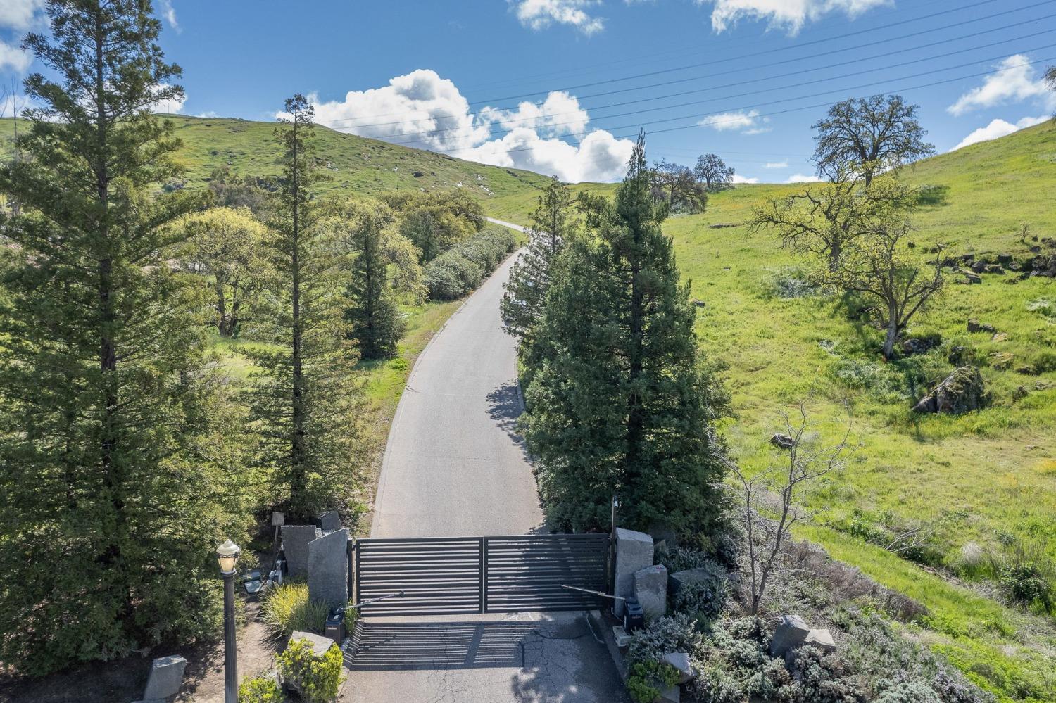13 Summit Crest Lane Clovis, CA 93619 - Photo 23 of 24 a view of a lake with a garden