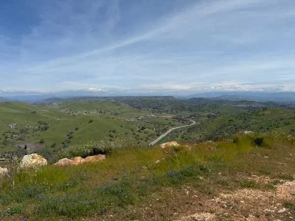 a view of mountain with lake view