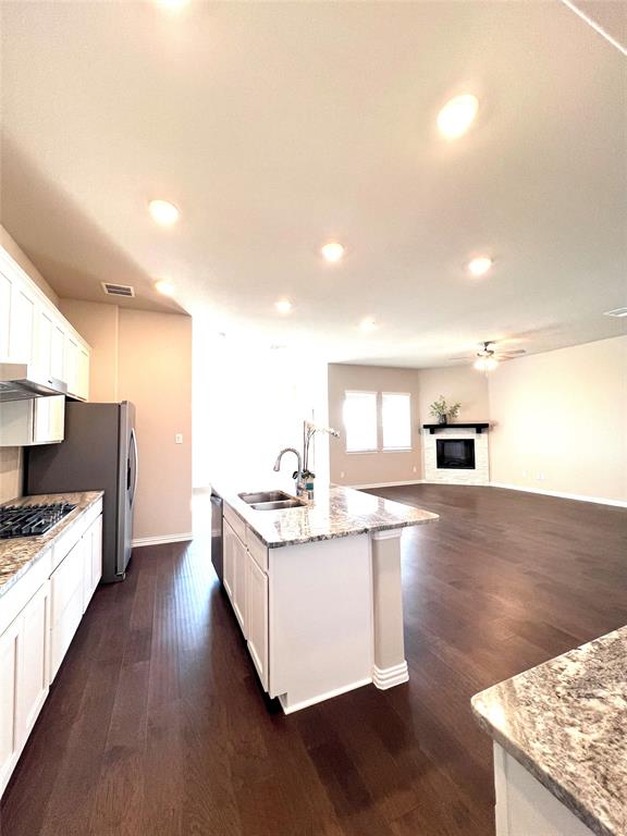 3305 Cross Shr Drive Anna, TX 75409 - Photo 12 of 31 Kitchen featuring a center island with sink, dishwasher, white cabinetry, and sink
