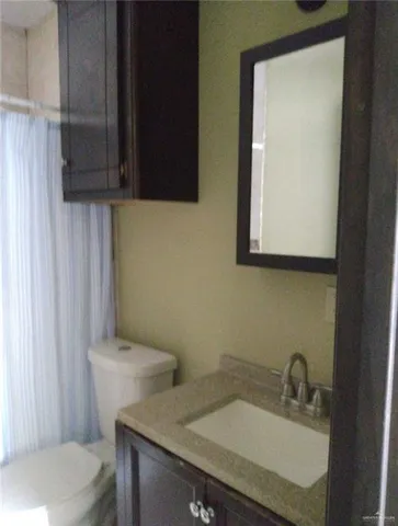 a kitchen with a stove and a refrigerator