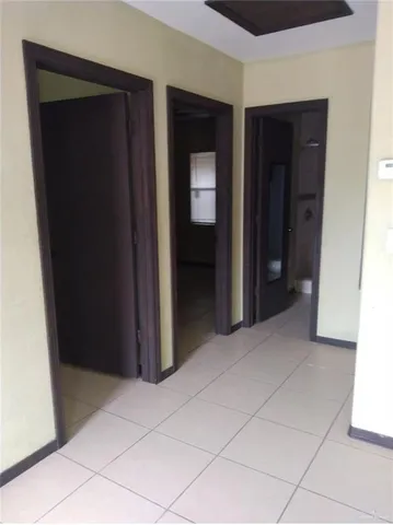 a fan room with a bed and a potted plant