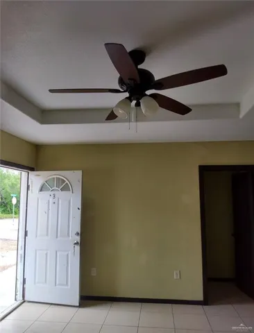 a kitchen with granite countertop cabinets and refrigerator
