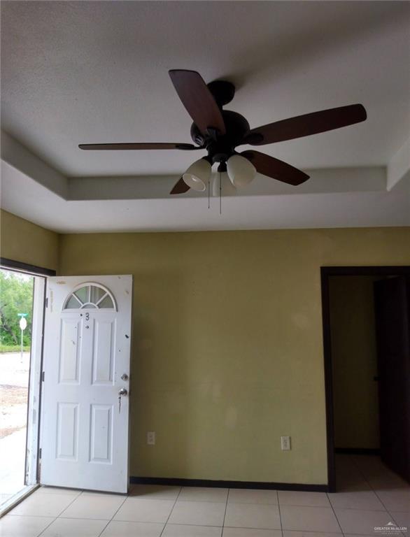 5497 East Guerra Street Rio Grande City, TX 78582 - Photo 10 of 13 a fan room with a bed and a potted plant