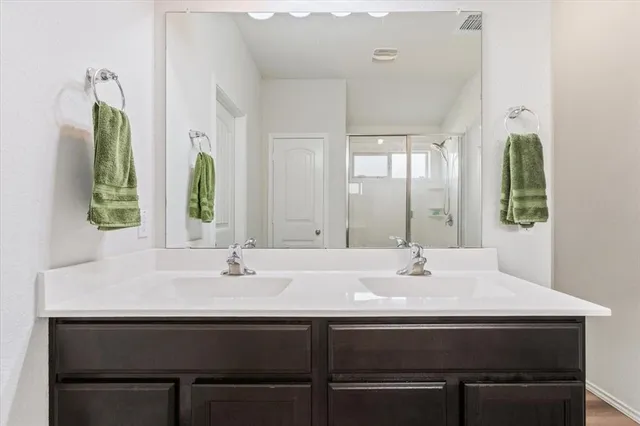 a sink with a mirror and a window