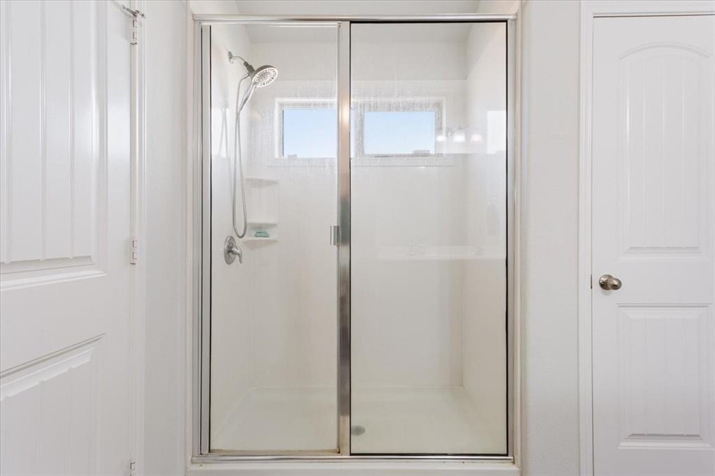 11204 Echo Drive Waco, TX 76708 - Photo 19 of 27 a bathroom with a glass shower door