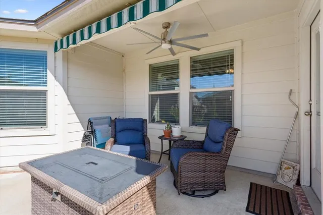 a living room with furniture and windows