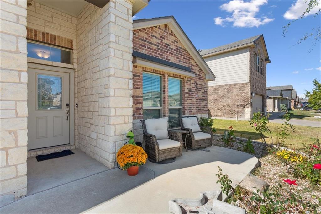 11204 Echo Drive Waco, TX 76708 - Photo 4 of 27 a view of a porch with chairs and potted plants