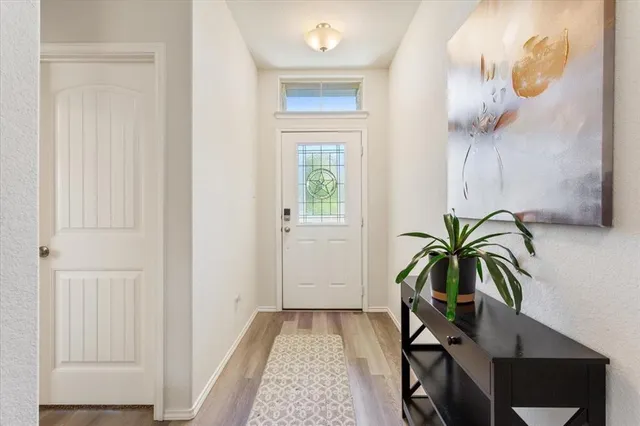 a view of entryway with wooden floor