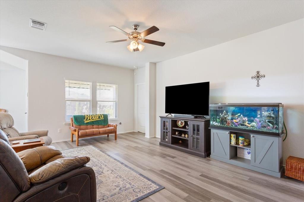11204 Echo Drive Waco, TX 76708 - Photo 7 of 27 a living room with furniture and a flat screen tv