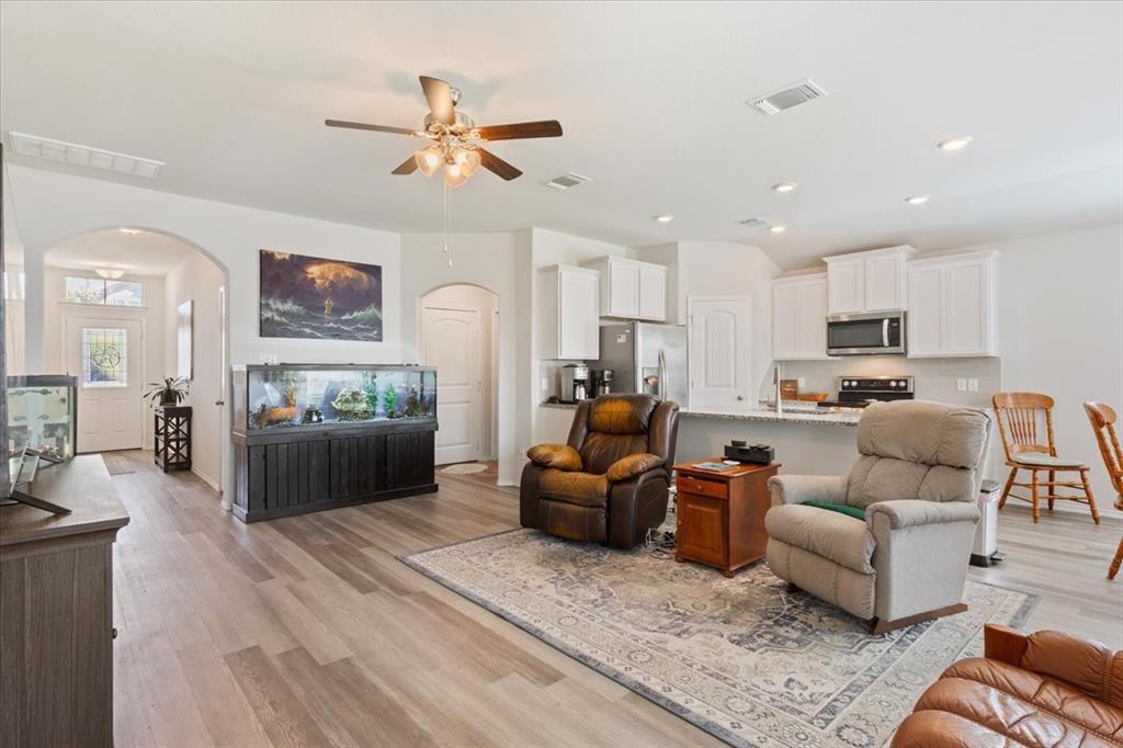 11204 Echo Drive Waco, TX 76708 - Photo 8 of 27 a living room with furniture kitchen area and a window