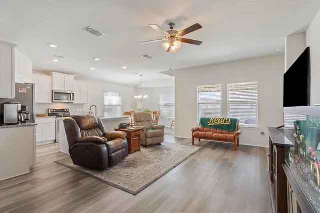 a living room with furniture fireplace and a flat screen tv