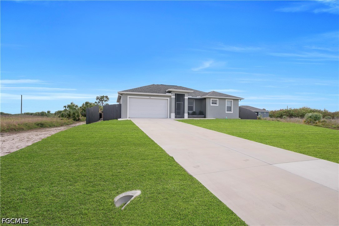 384 Neighborly Road LaBelle, FL 33935 - Photo 4 of 45 a view of house with a big yard