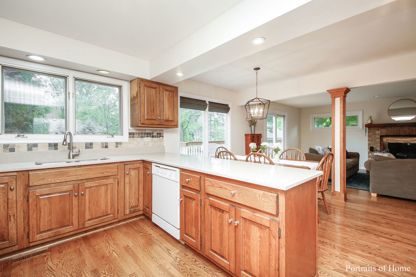 1S781 Carrol Gate Road Wheaton, IL 60189 - Photo 12 of 30 a large kitchen with kitchen island granite countertop a sink and a stove top oven