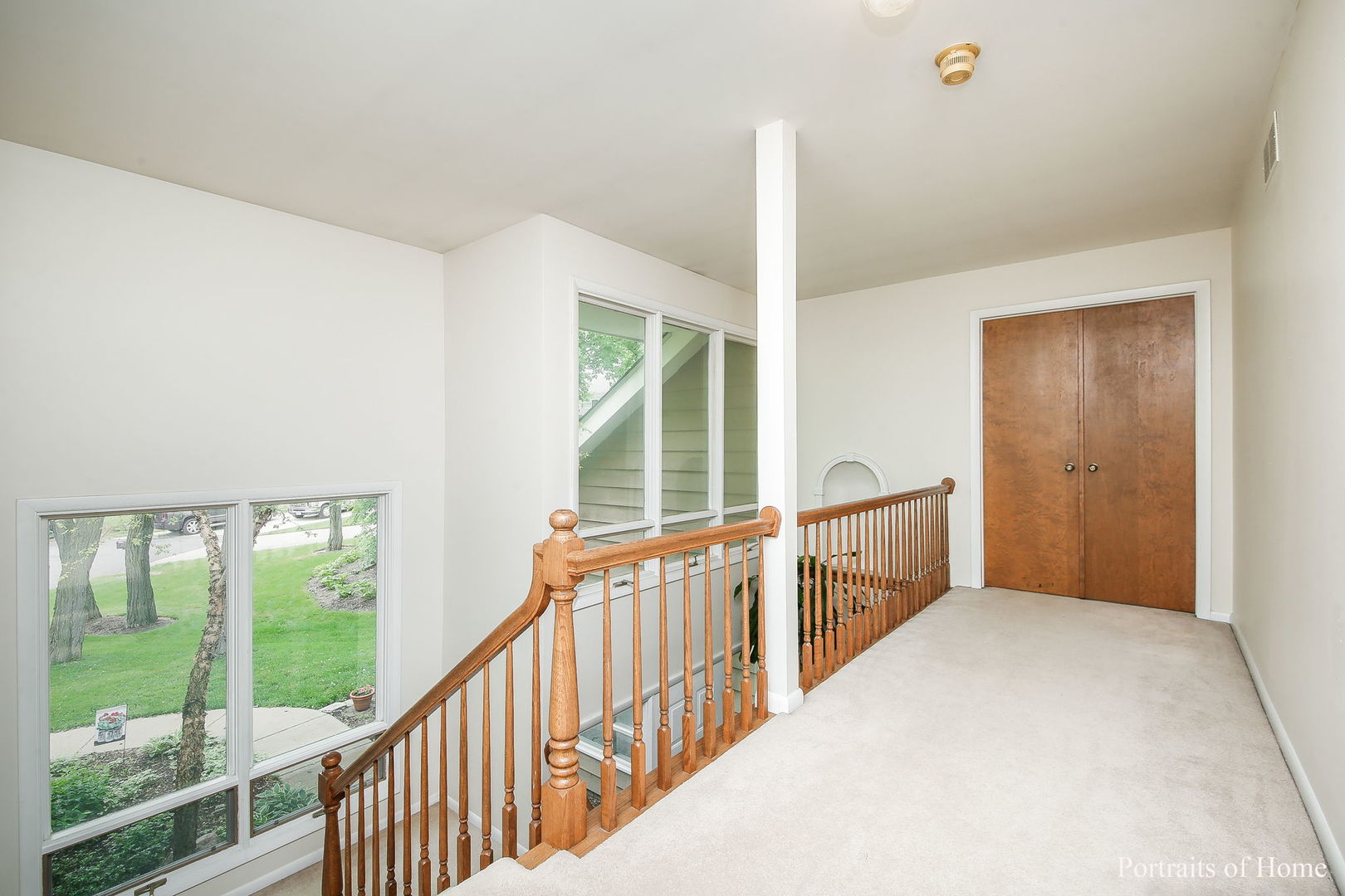 1S781 Carrol Gate Road Wheaton, IL 60189 - Photo 17 of 30 a view of a hallway with windows