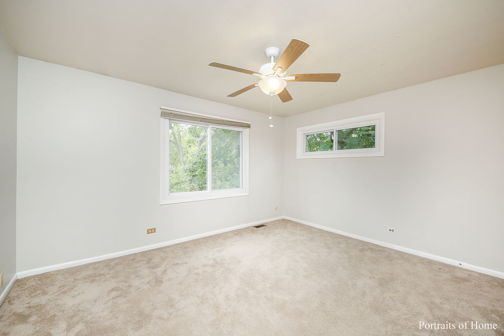 1S781 Carrol Gate Road Wheaton, IL 60189 - Photo 21 of 30 an empty room with windows and fan