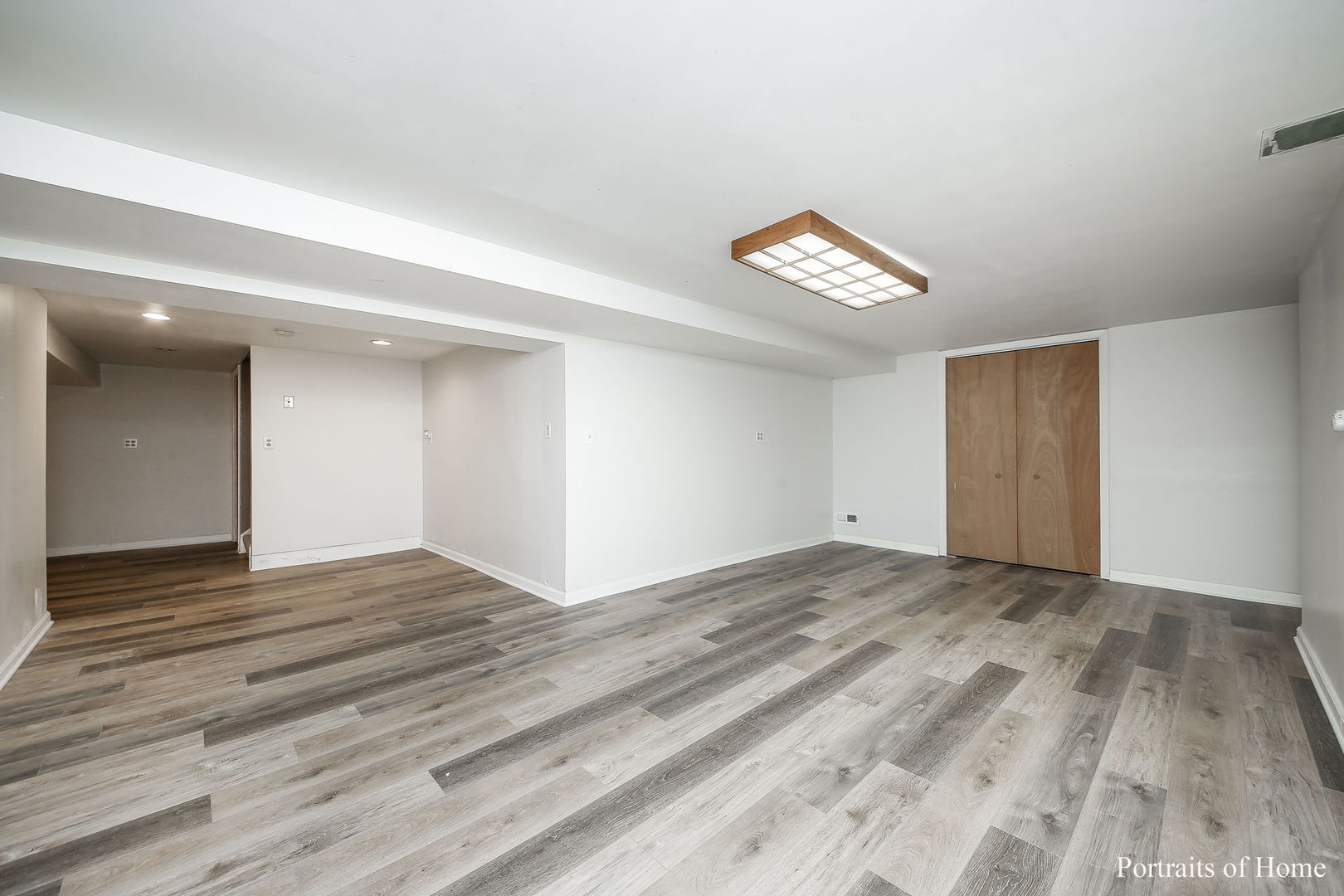 1S781 Carrol Gate Road Wheaton, IL 60189 - Photo 27 of 30 a view of an empty room with wooden floor and a window