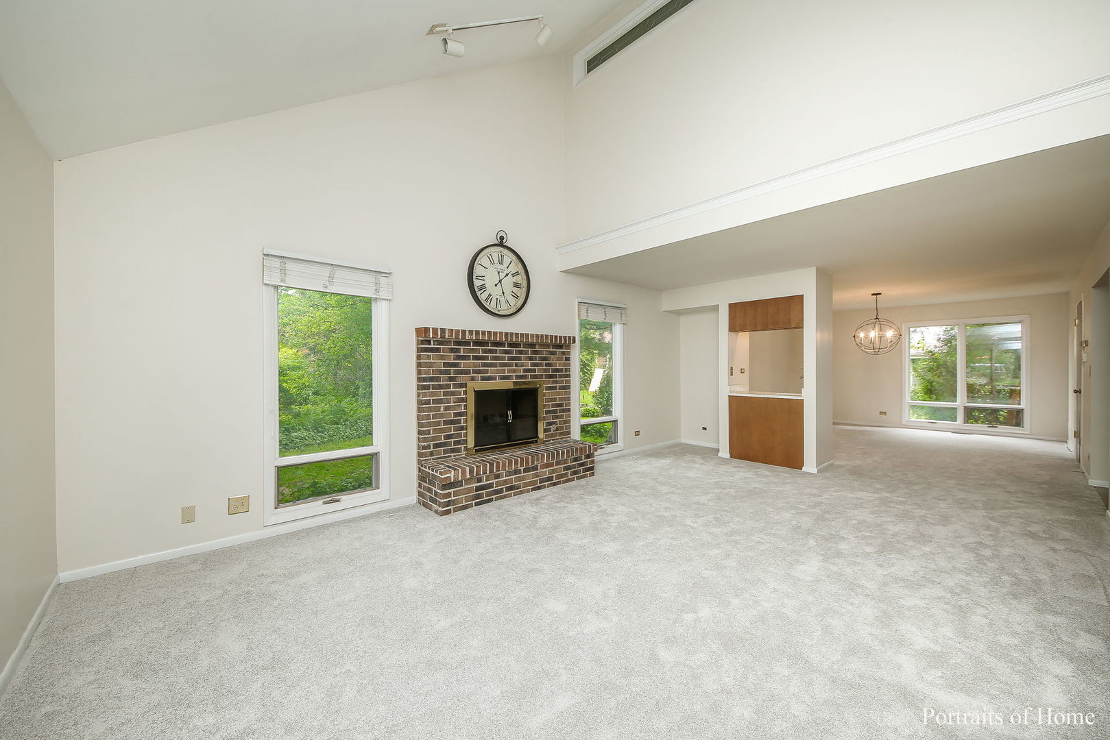 1S781 Carrol Gate Road Wheaton, IL 60189 - Photo 4 of 30 an empty room with windows and fireplace