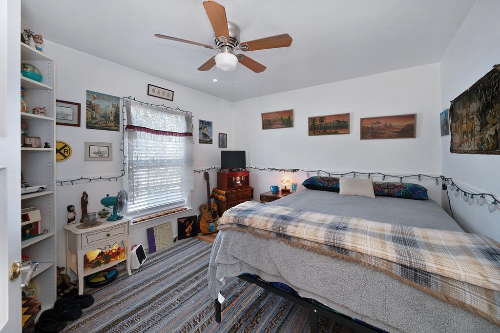 12365 Reba Road Auburn, CA 95603 - Photo 12 of 62 a bed room with bed and a book shelf