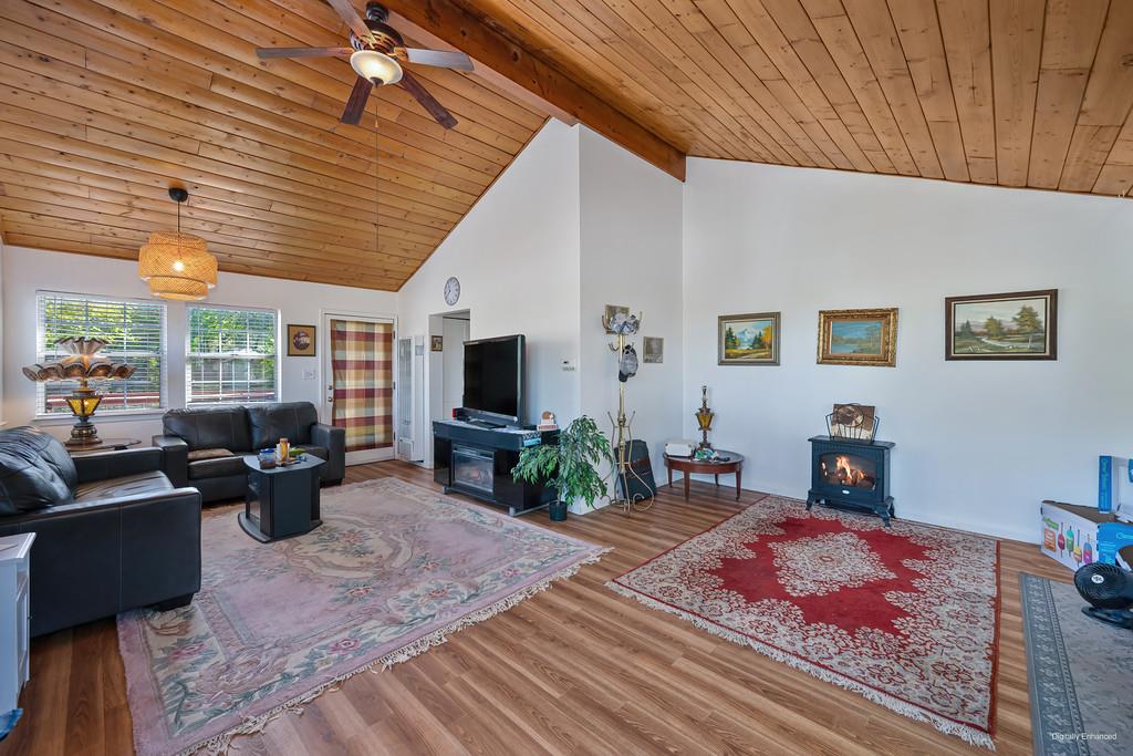 12365 Reba Road Auburn, CA 95603 - Photo 8 of 62 a living room with furniture and a flat screen tv