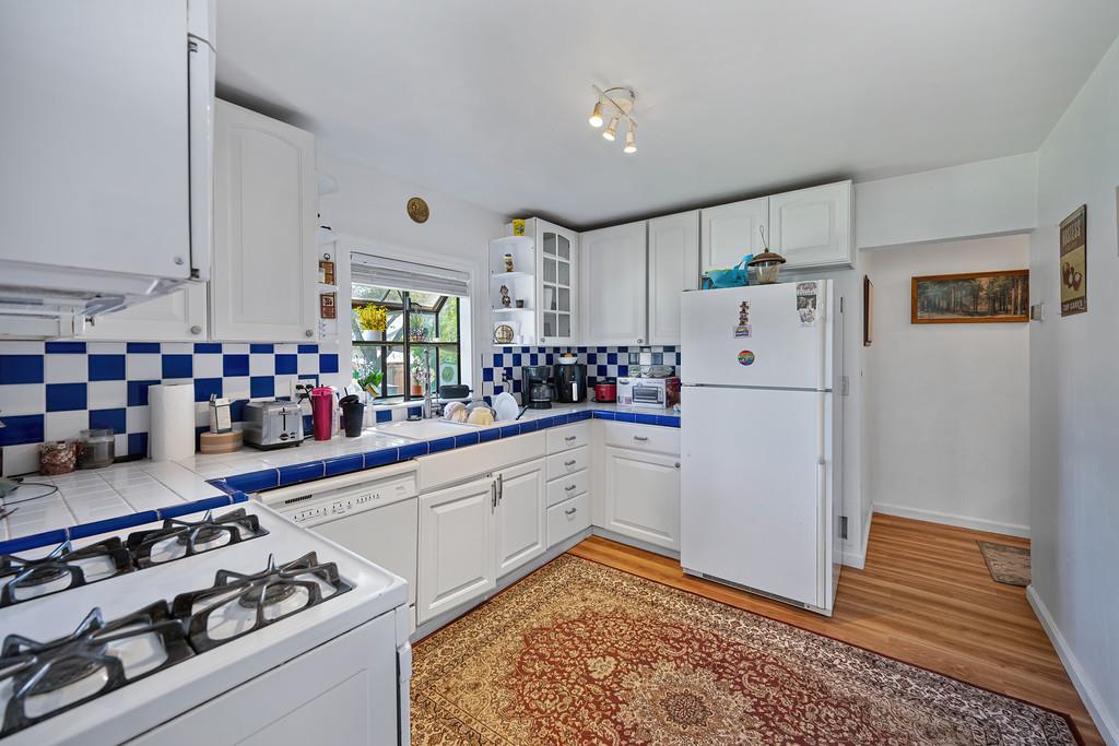 12365 Reba Road Auburn, CA 95603 - Photo 10 of 62 a kitchen with a refrigerator and a stove