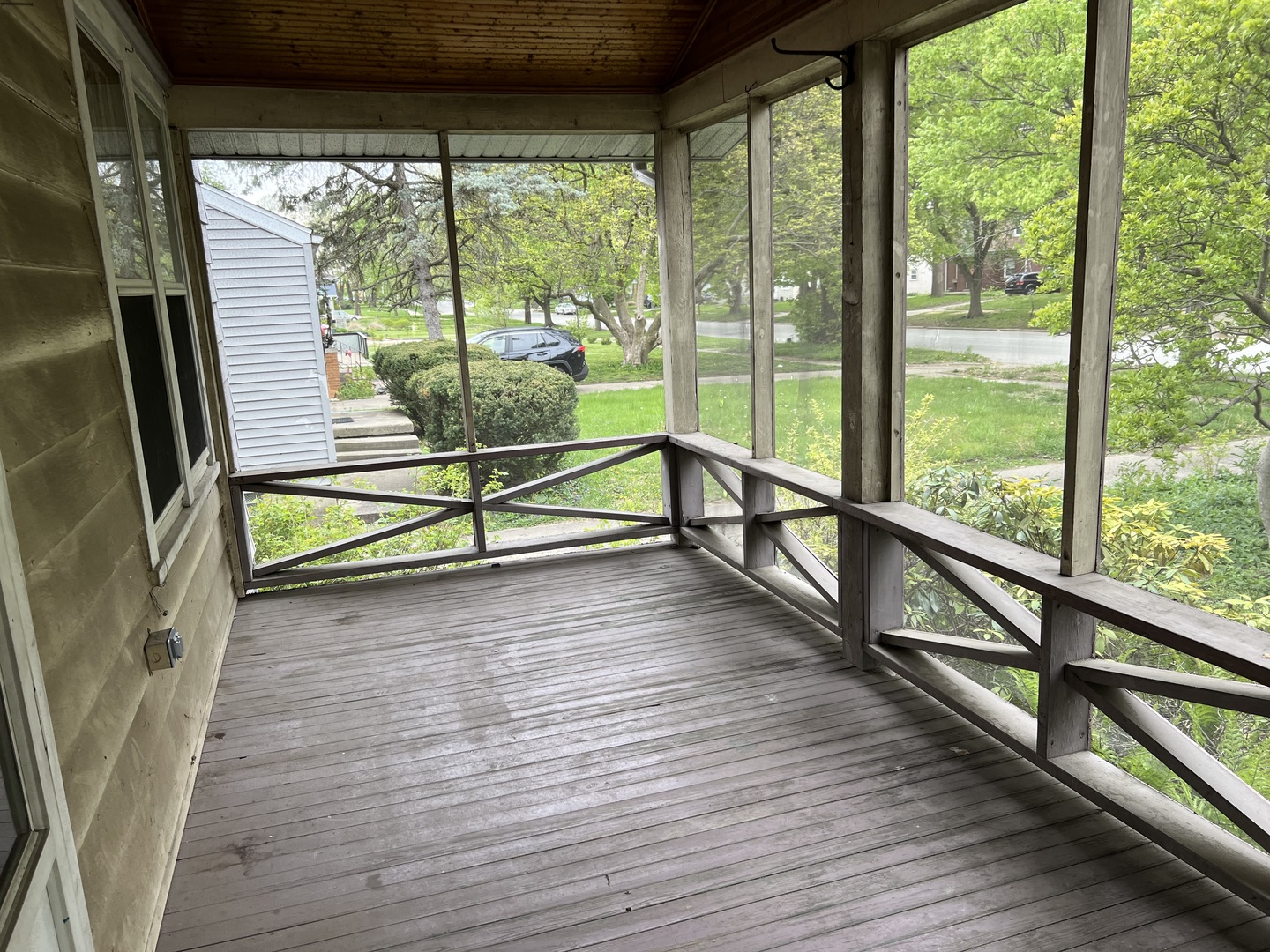 1605 West University Avenue Champaign, IL 61821 - Photo 2 of 8 a view of a room with wooden floor and windows