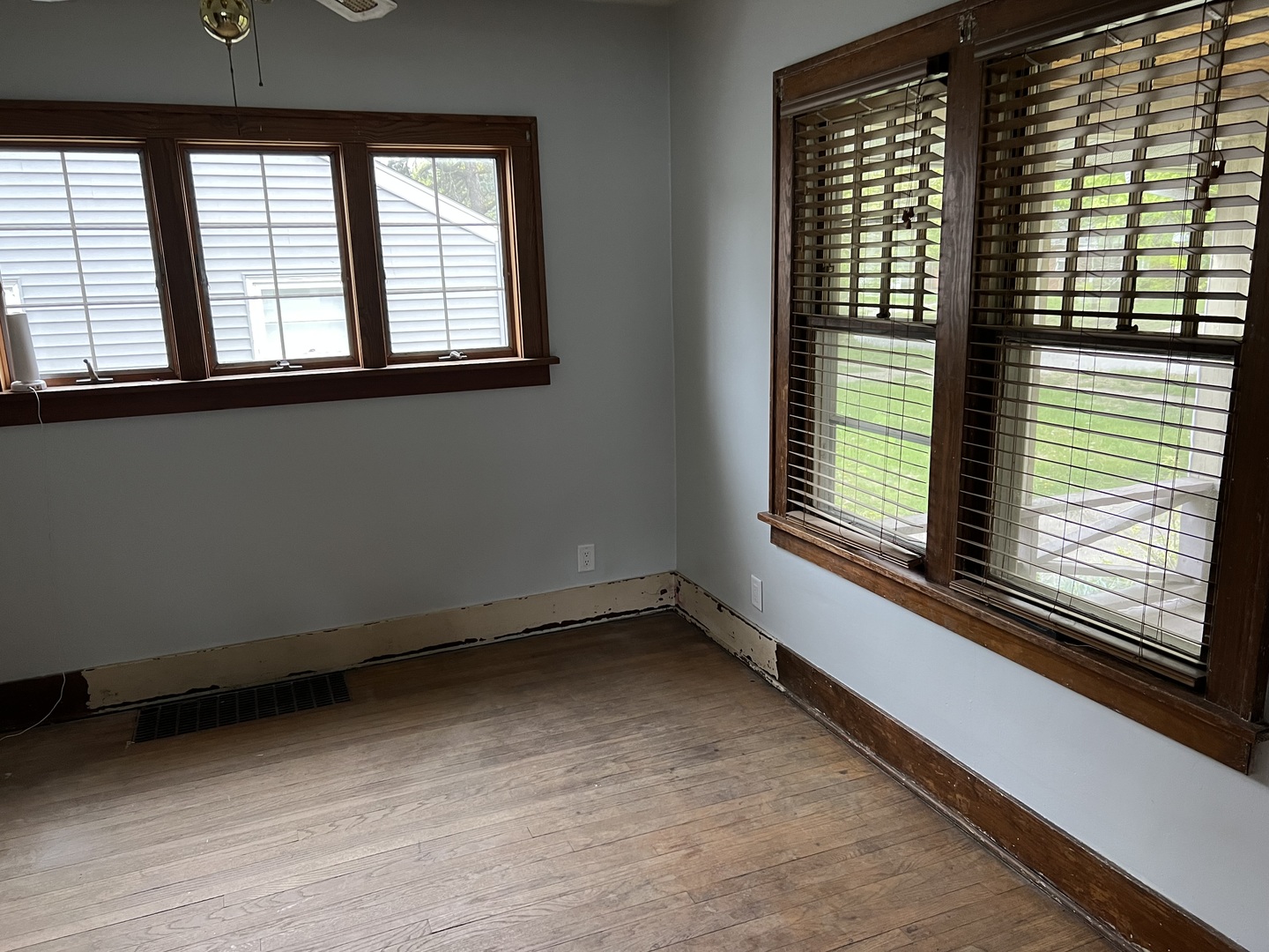 1605 West University Avenue Champaign, IL 61821 - Photo 4 of 8 a view of an empty room with a window