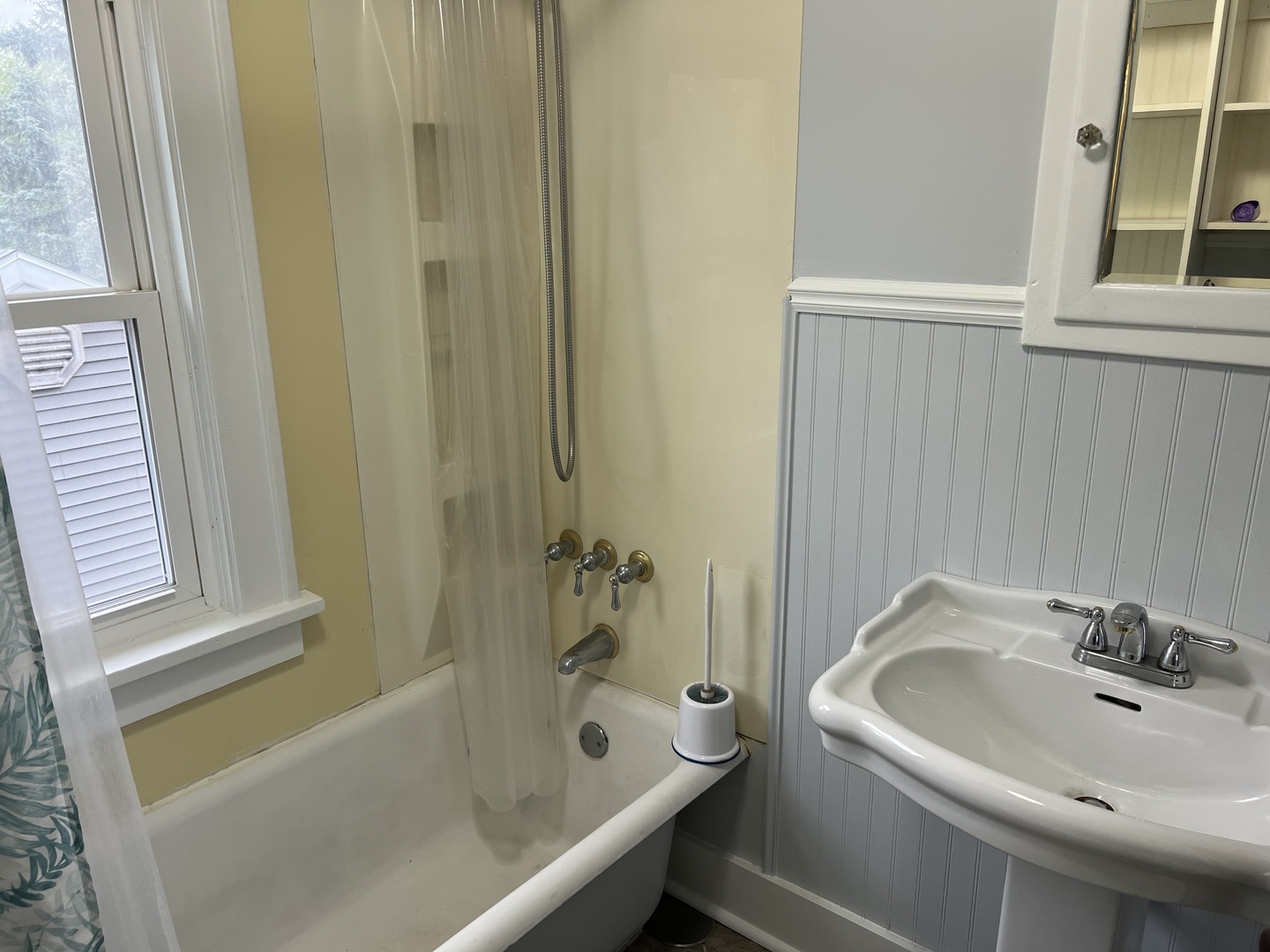 1605 West University Avenue Champaign, IL 61821 - Photo 8 of 8 a bathroom with a sink and a bathtub
