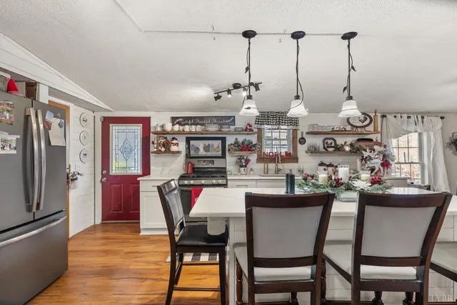 a dining room with furniture and window