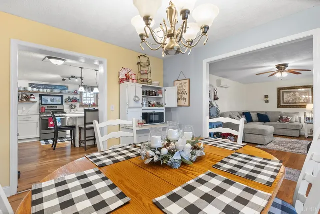 a living room with furniture a rug and white walls