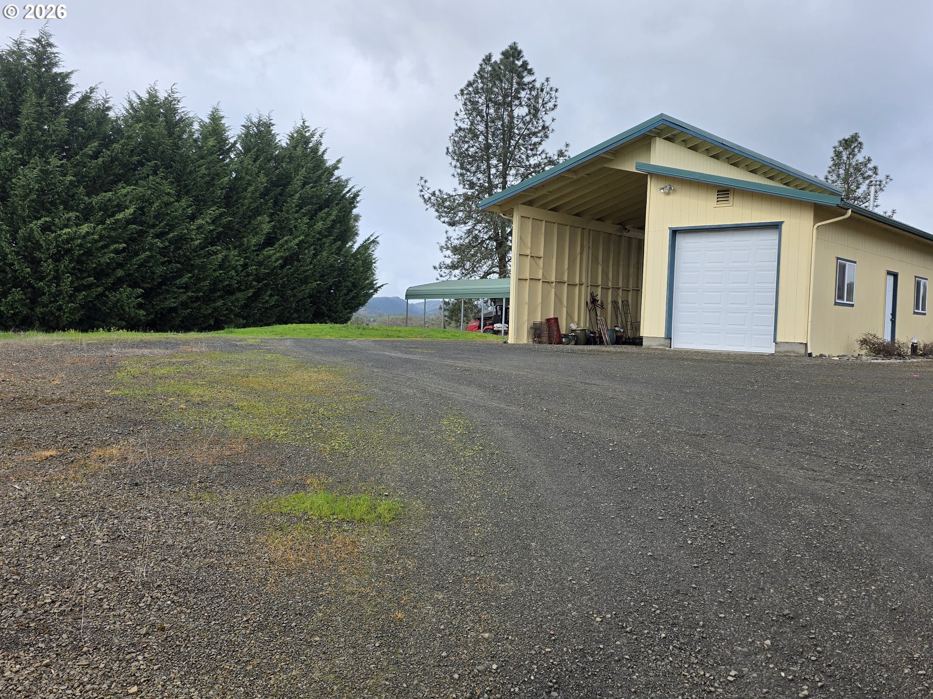 1909 Southwest Duke Road Sutherlin, OR 97479 - Photo 5 of 30 a front view of a house with a yard and garage