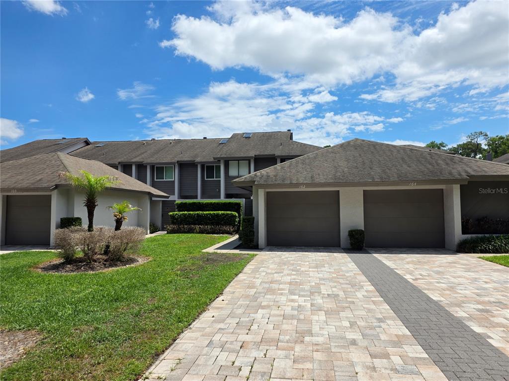 162 Olive Tree Circle Altamonte Springs, FL 32714 - Photo 1 of 47 a front view of house with yard and green space