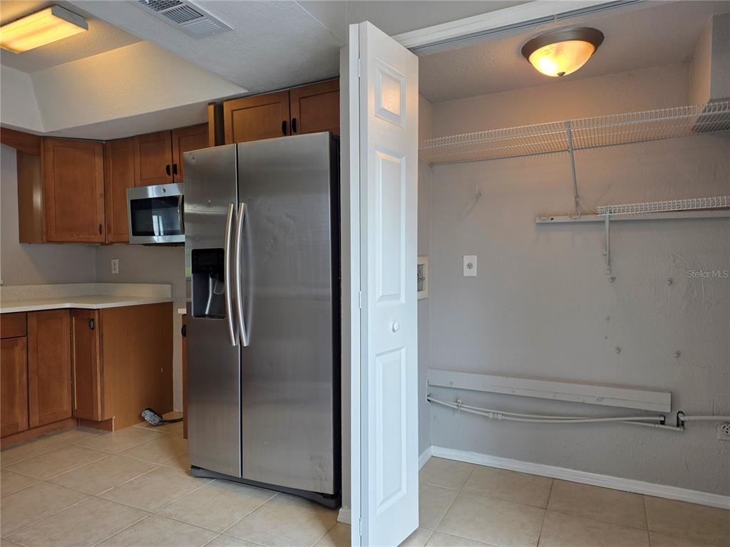 162 Olive Tree Circle Altamonte Springs, FL 32714 - Photo 11 of 47 a metallic refrigerator freezer sitting in a kitchen