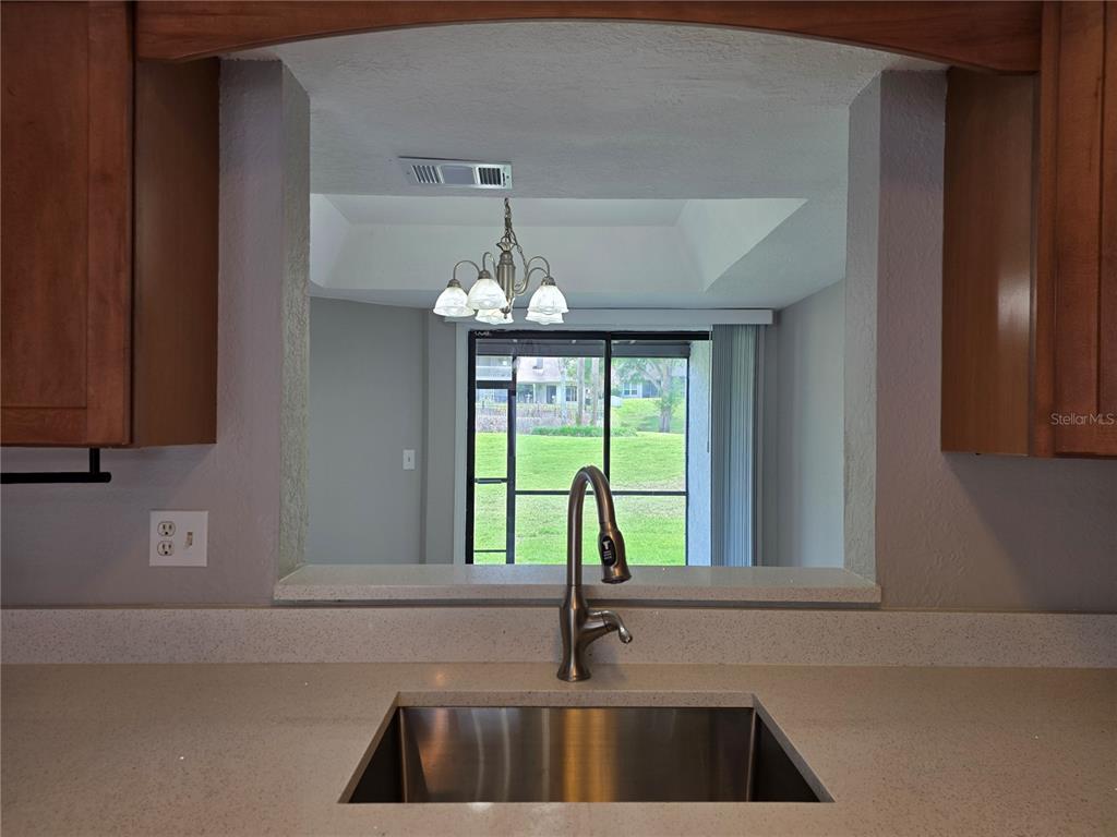 162 Olive Tree Circle Altamonte Springs, FL 32714 - Photo 14 of 47 a kitchen with a sink and large window