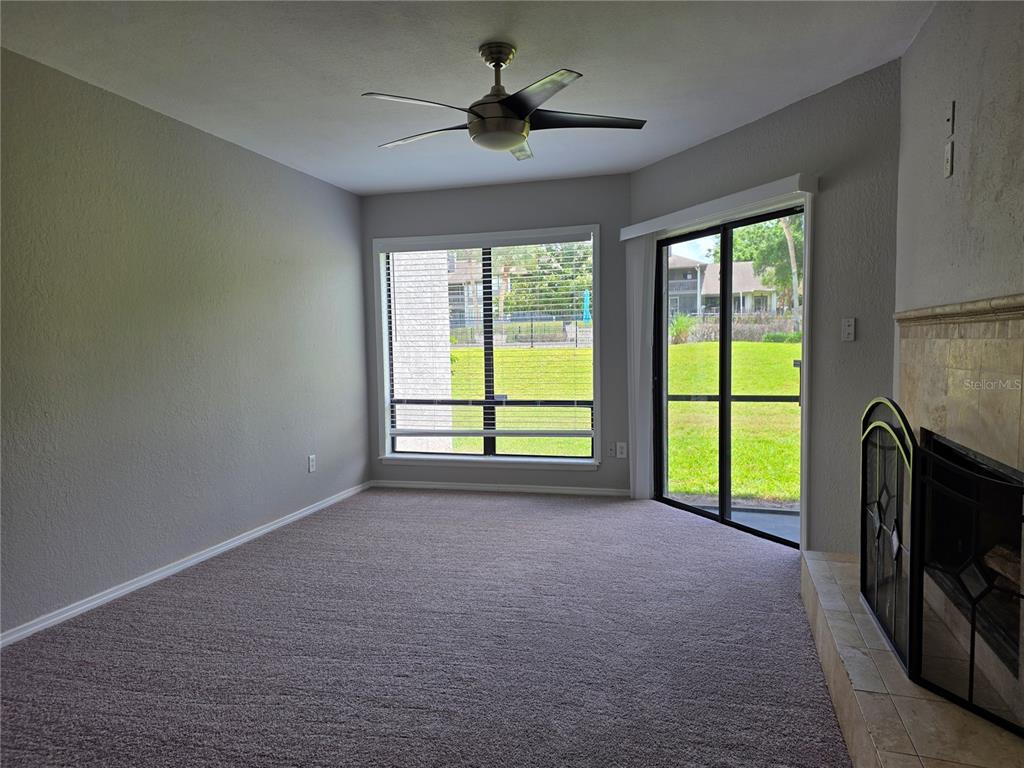 162 Olive Tree Circle Altamonte Springs, FL 32714 - Photo 17 of 47 a view of an empty room with a fireplace and a window