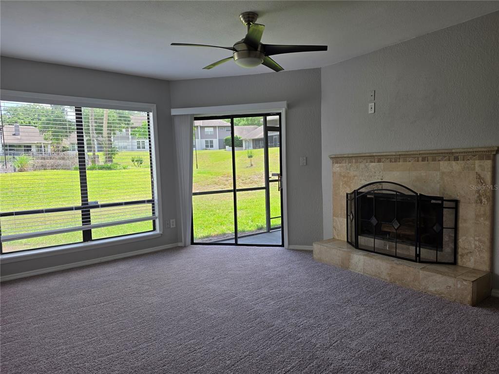 162 Olive Tree Circle Altamonte Springs, FL 32714 - Photo 18 of 47 a view of an empty room with a fireplace and a window