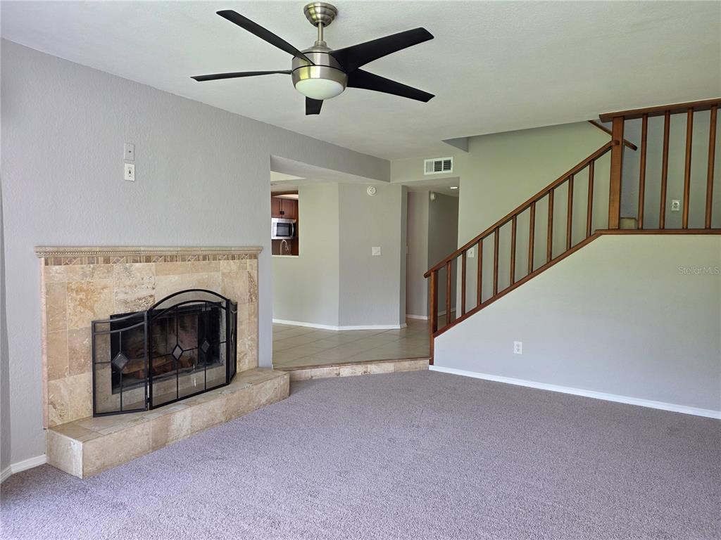 162 Olive Tree Circle Altamonte Springs, FL 32714 - Photo 19 of 47 a view of an empty room with fireplace and a window