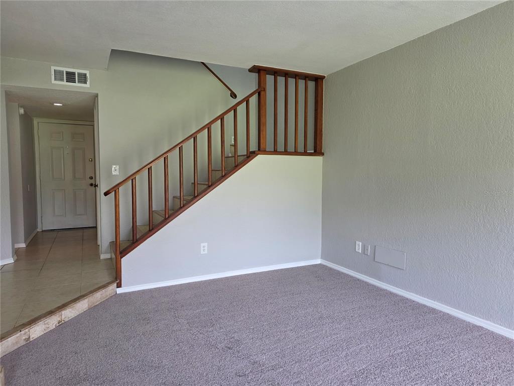 162 Olive Tree Circle Altamonte Springs, FL 32714 - Photo 20 of 47 a view of a hallway with staircase