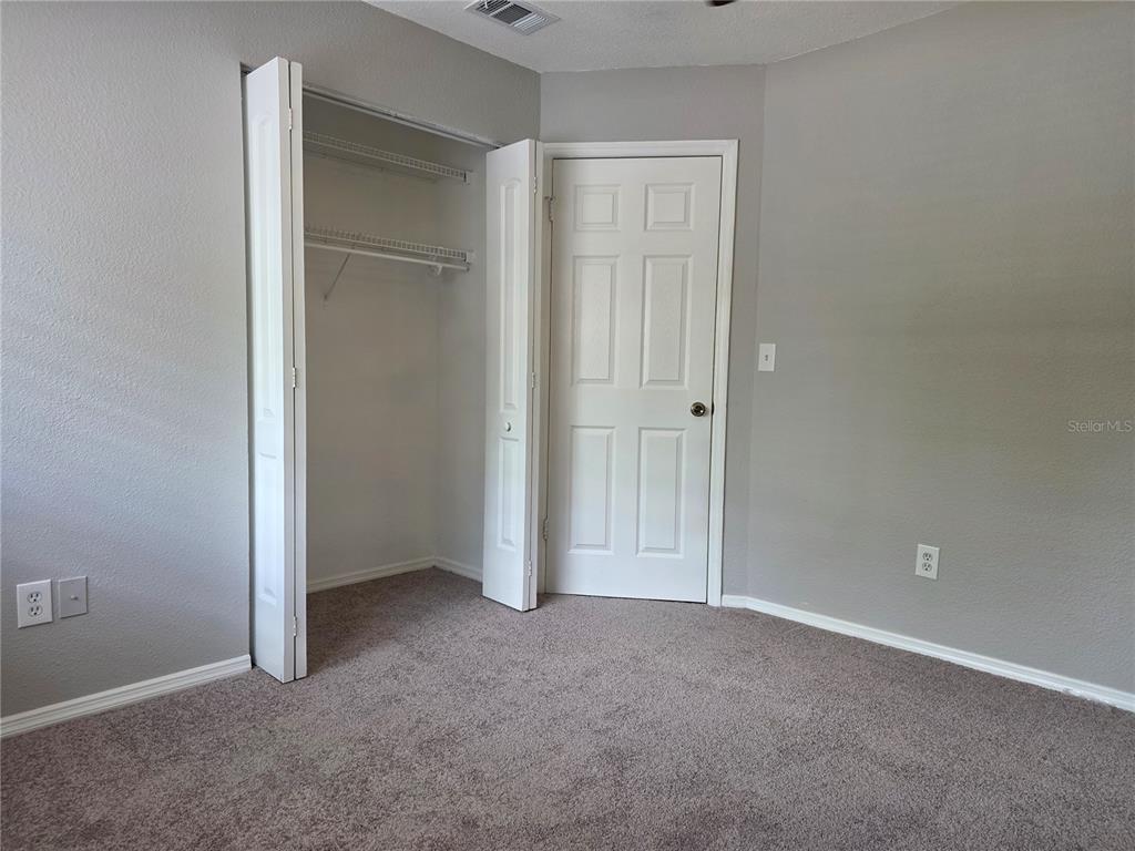162 Olive Tree Circle Altamonte Springs, FL 32714 - Photo 32 of 47 an empty room with closet area