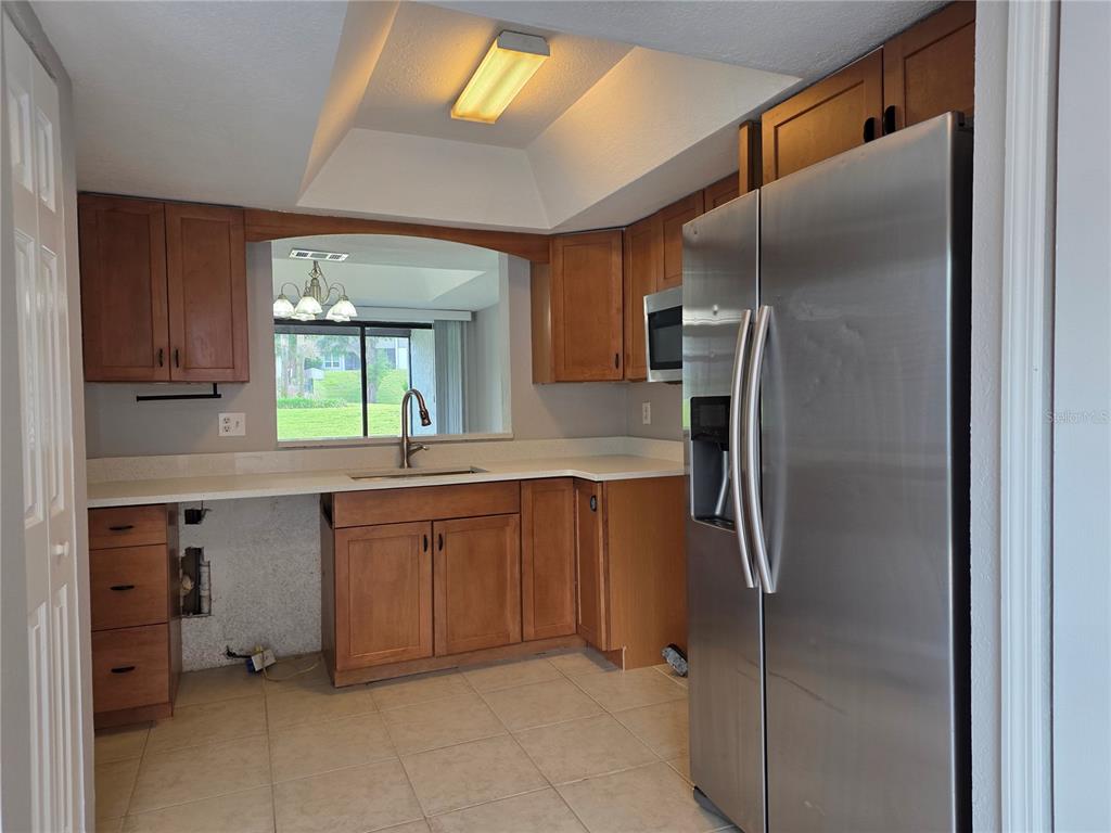 162 Olive Tree Circle Altamonte Springs, FL 32714 - Photo 10 of 47 a kitchen with stainless steel appliances granite countertop a refrigerator and a sink