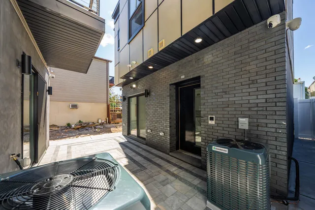 a balcony with a couch and wooden floor