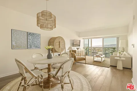 a dining room with furniture a chandelier