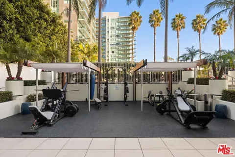 a view of a patio with couches chairs and potted plants