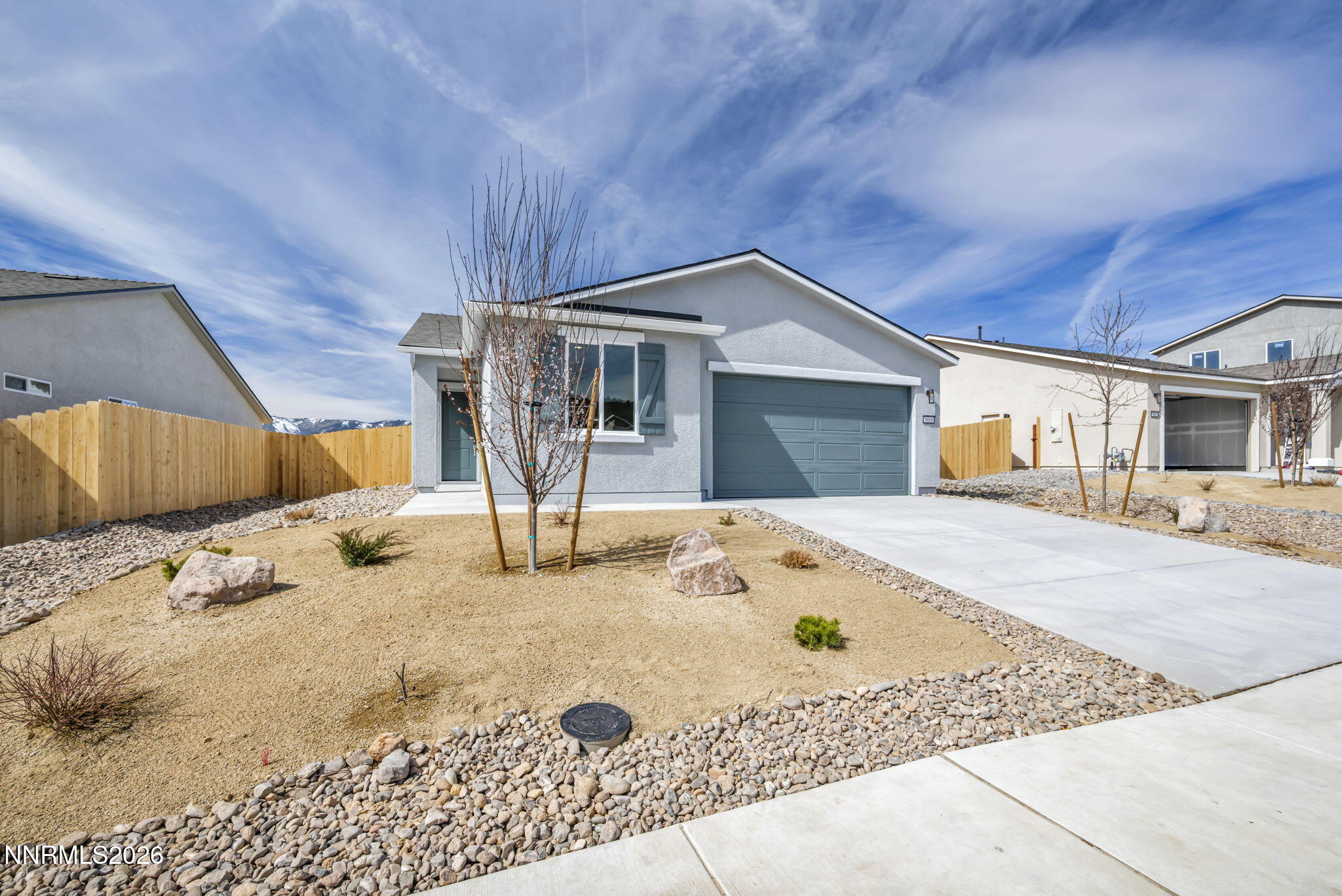 a view of a house with snow on the road