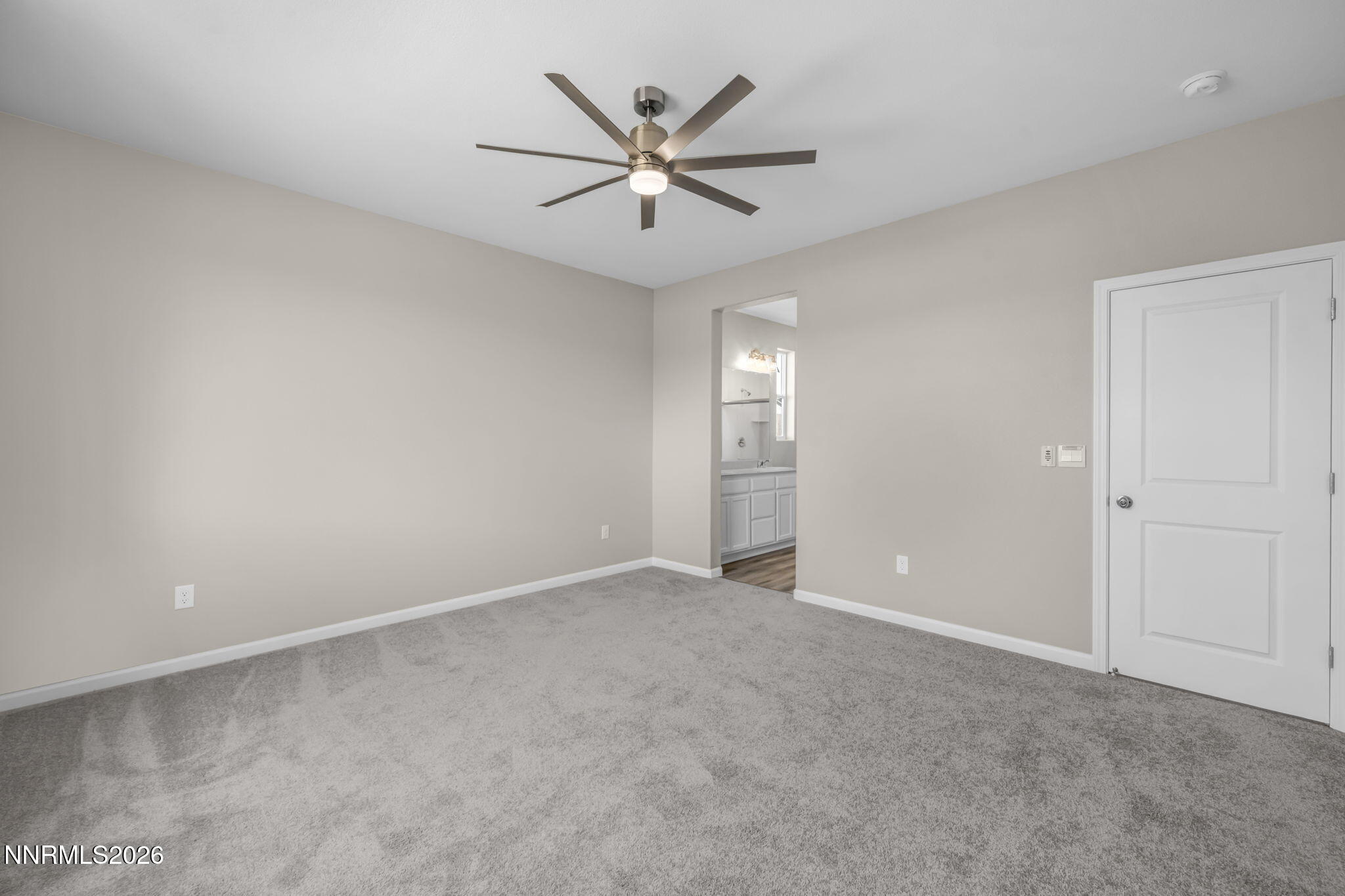 6668 Morgan Mill Road, Unit HOMESITE 15 Carson City, NV 89701 - Photo 11 of 25 an empty room with closet and ceiling fan