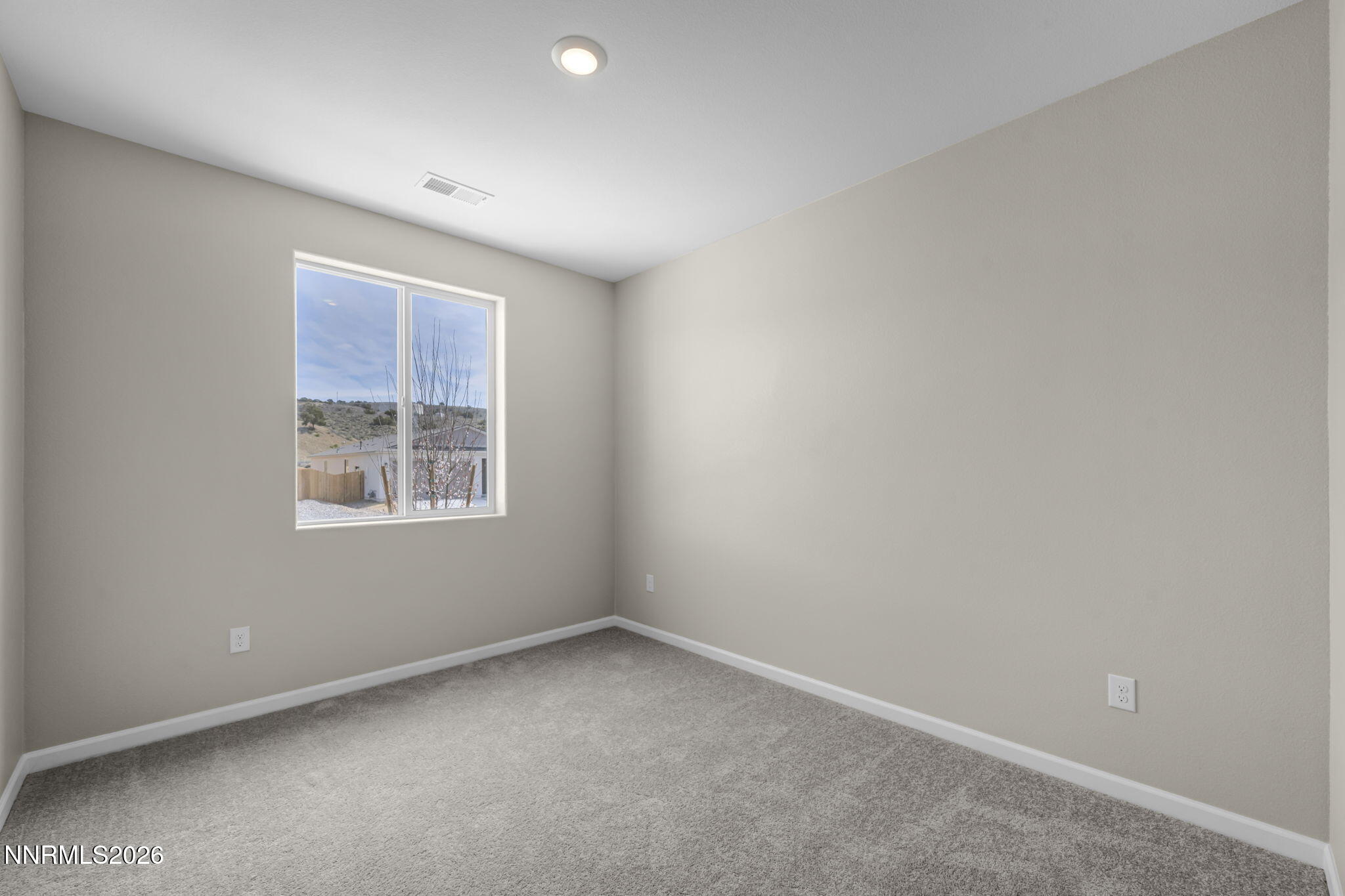 6668 Morgan Mill Road, Unit HOMESITE 15 Carson City, NV 89701 - Photo 14 of 25 an empty room with a window
